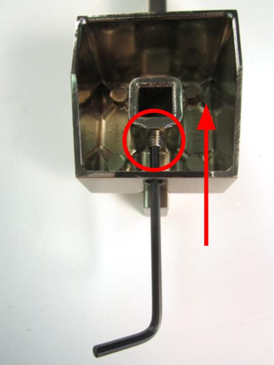 If you are installing a new handle, install the set screw on the new handle. To do so, place the set screw on the tip of the hex wrench. Use the hex wrench to install the set screw on the new handle.