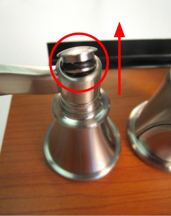 If the handle cap does not unscrew, use a flat-head screwdriver to remove the handle cap. 