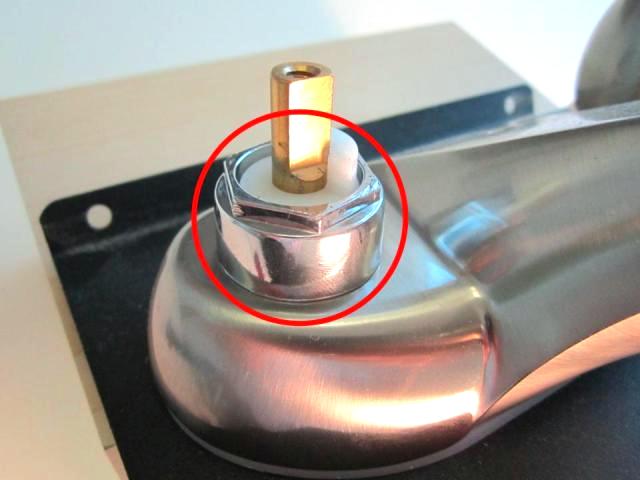 Using a pair of adjustable pliers, remove the locking nut.