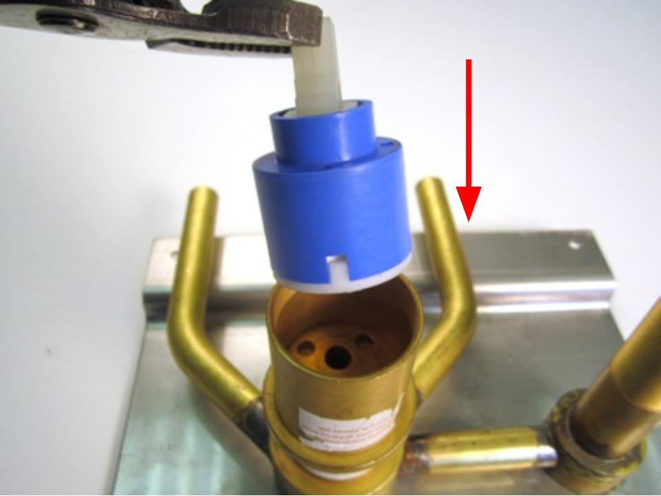 Insert the cartridge and rotate it until it slides down into place.
