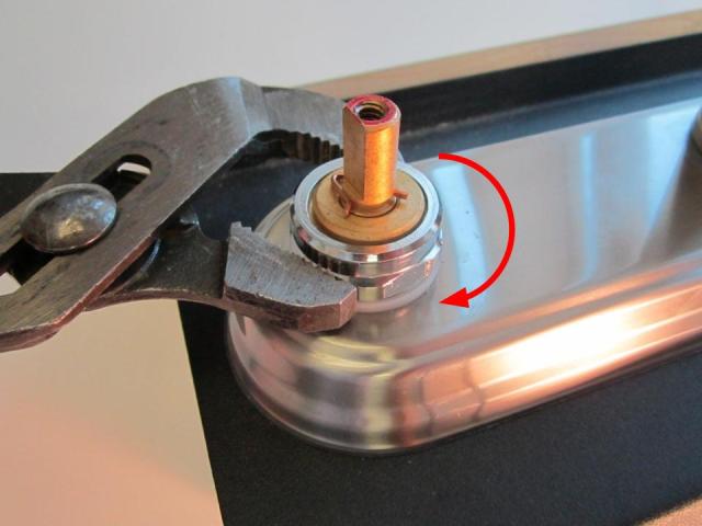 Re-install the locking nut with a pair of adjustable pliers. To avoid over-tightening the locking nut, hand tighten the locking nut, and then use the adjustable pliers to apply a quarter turn. Approximately 10-14 lbs of torque are required to properly install the locking nut.