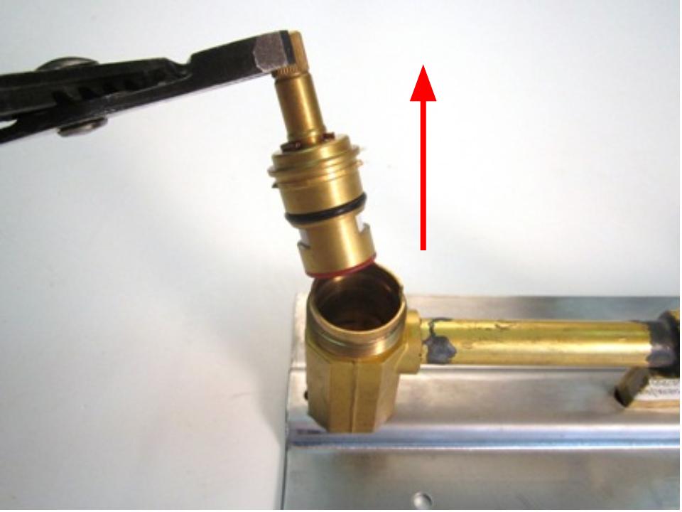 Hold the stem of the cartridge and pull out until the cartridge is completely removed from the faucet body