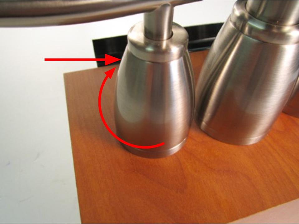 Screw the handle base clockwise until it stops turning and the handle base is firmly attached to the faucet.