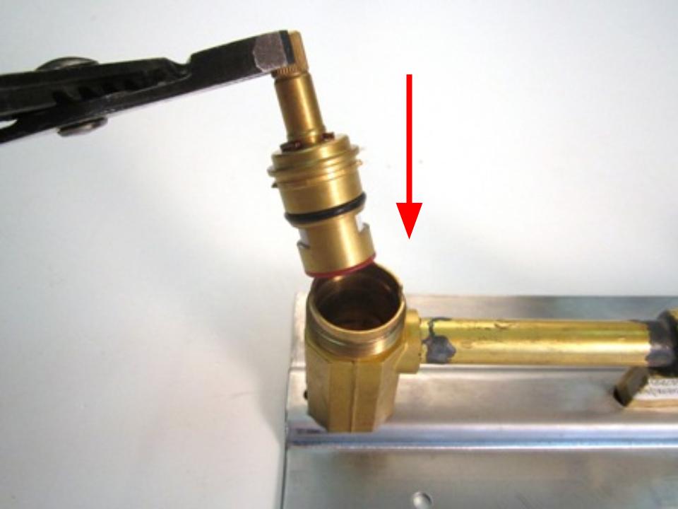 To install the new cartridge, slide the cartridge into the faucet body and rotate the cartridge until the notches on the cartridge line up with the openings in the faucet body