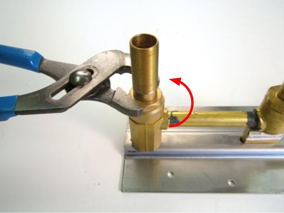 Using a pair of adjustable pliers, unscrew the locking nut counter clockwise to remove it