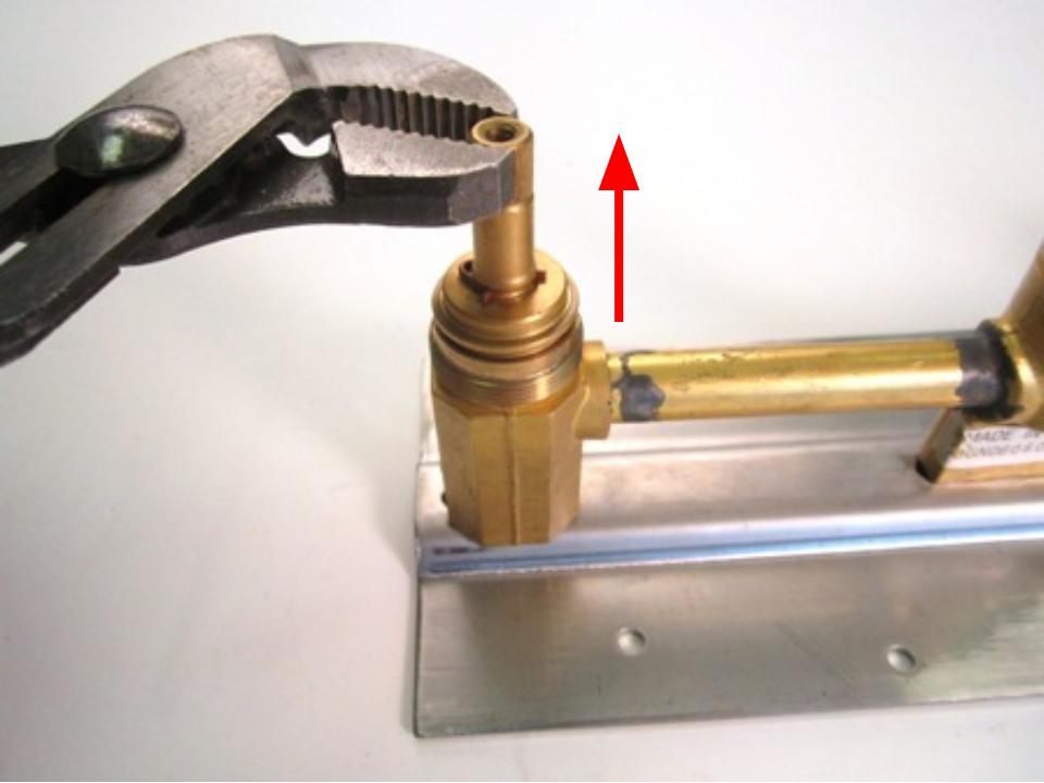 Hold the stem of the cartridge and pull out until the cartridge is completely removed from the faucet body
