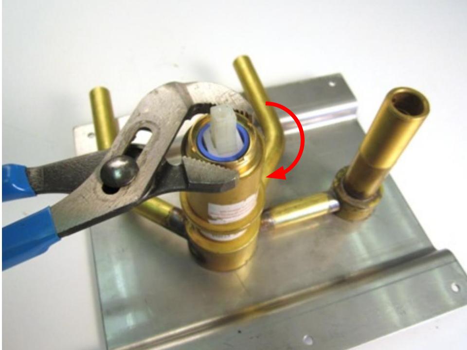 Re-install the locking nut with a pair of adjustable pliers. To avoid over-tightening the locking nut, hand tighten the locking nut, and then use the adjustable pliers to apply a quarter turn. Overall 10-14 lbs of torque are required to properly install the locking nut. 