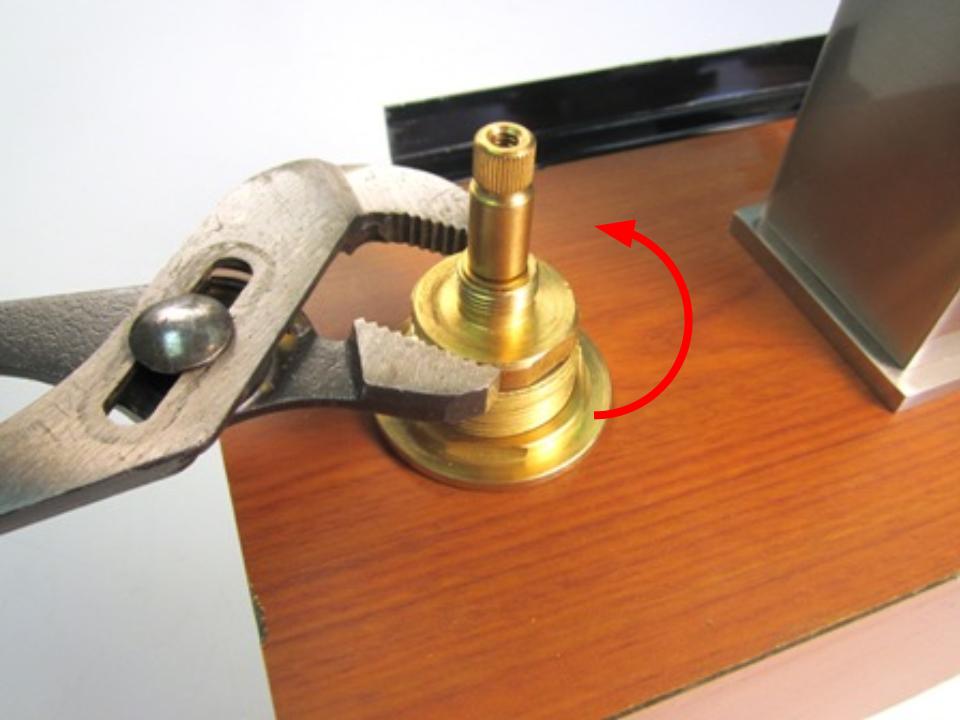  The cartridge is threaded into the faucet body. To remove the cartridge, use adjustable pliers to unscrew the cartridge counter-clockwise.