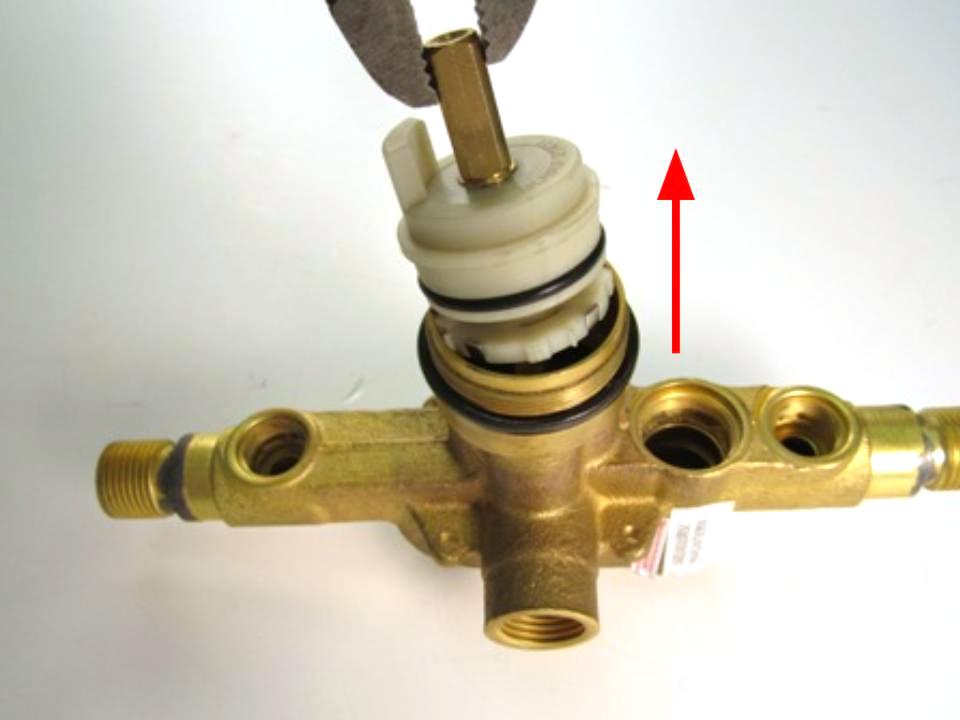 Hold the stem of the cartridge and pull out until the cartridge is completely removed from the faucet body