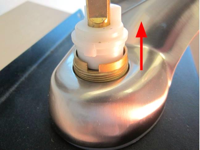 Hold the stem of the cartridge and pull up until the cartridge is completely removed from the faucet body.