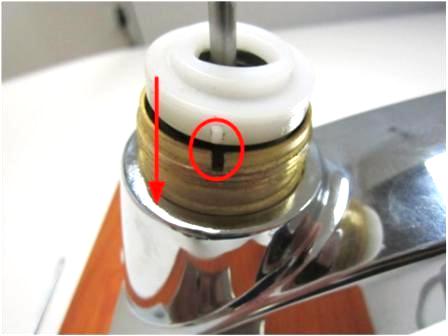 Ensure that the cam is properly installed by lining up the tab on the cam with the opening in the faucet body. 