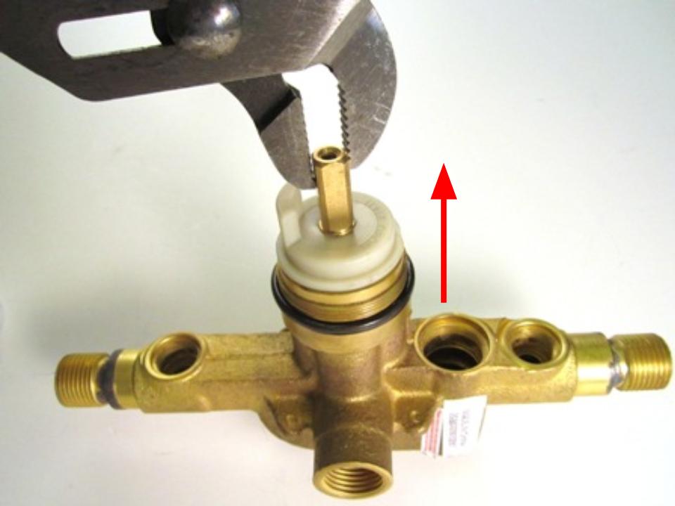 Hold the stem of the cartridge and pull out until the cartridge is completely removed from the faucet body