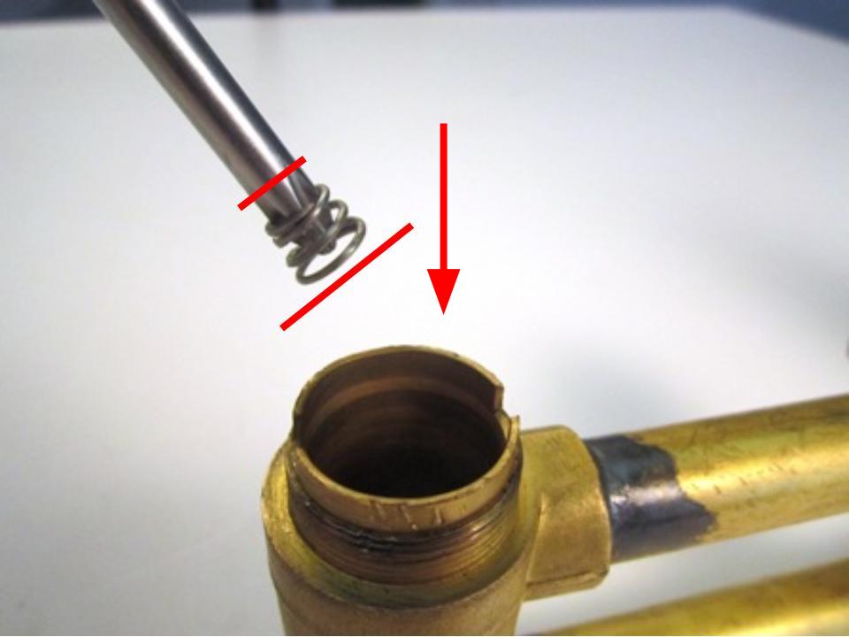 Install the new seats and springs. To do so, insert the spring into the faucet body. The larger end of the spring goes in first. Next, install the rubber seat over the spring.
