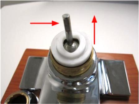 Hold the stem of the cartridge and lift the ball valve out of the faucet.