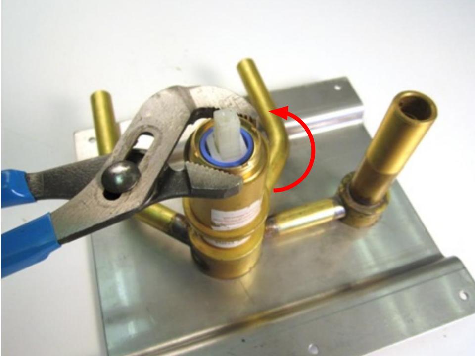 Using a pair of adjustable pliers, remove the locking nut.