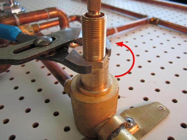 Using a pair of adjustable pliers, unscrew the cartridge counter-clockwise until the cartridge is completely removed from the faucet body.