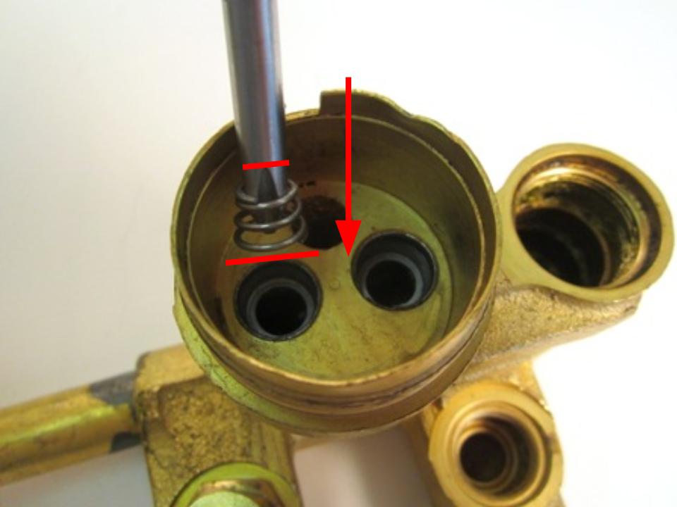  Install the new seats and springs. To do so, insert the spring into the faucet body. The larger end of the spring goes in first.