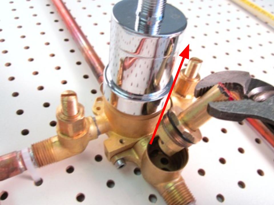 Once the retainer nut is removed, pull the diverter out of the faucet body to remove it.