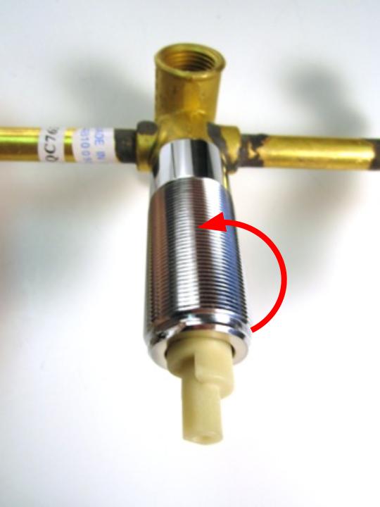Using a pair of adjustable pliers, remove the threaded sleeve assembly by turning counter-clockwise.