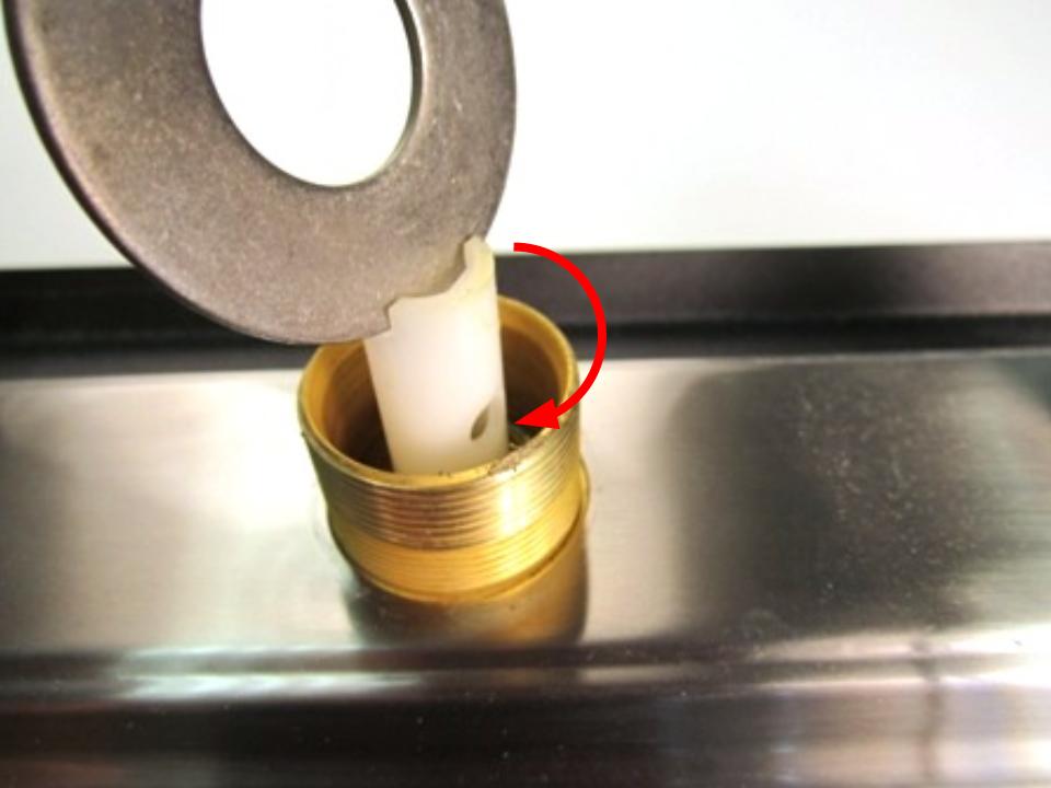 Slide the diverter into the faucet body. Using the tool you used to remove the diverter, screw the diverter into the faucet body by turning clockwise.