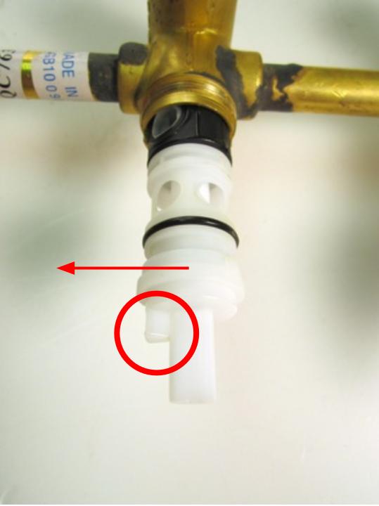To properly orient the cartridge, rotate the cartridge so that the stopper is on the left side.