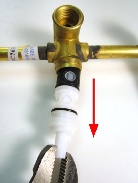 Remove the stem extension. To do so, pull the stem extension off of the cartridge assembly.