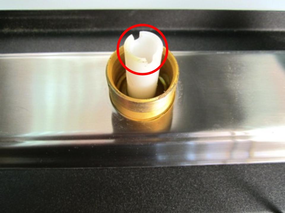  Once the spout has been removed, the top of the diverter should be visible. Locate the two openings and insert a flat tool or object. Turn counter-clockwise until it is completely removed from the faucet body.