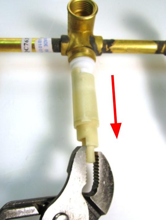 Remove the stem extension. To do so, pull the stem extension off of the cartridge assembly.