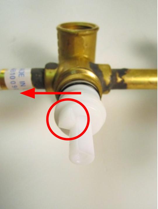 To properly orient the cartridge, rotate the cartridge so that the stopper is on the left side.
