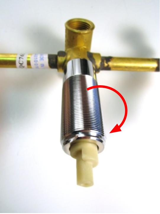 Re-install the threaded sleeve with a pair of adjustable pliers.