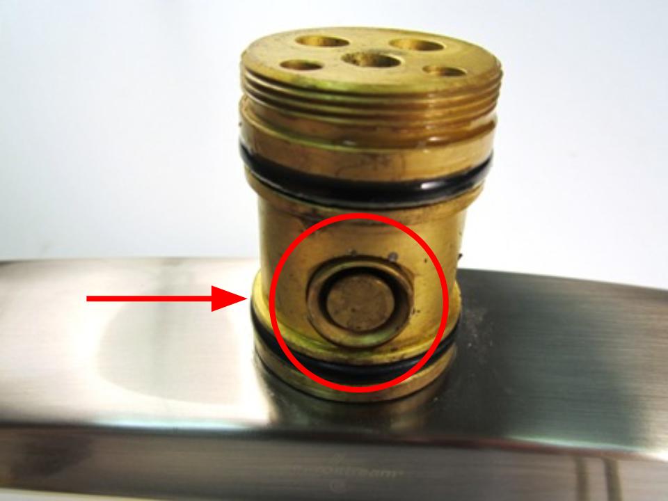 Once the spout is removed, the diverter will be visible. Use a tool with a thin flat edge to pry the diverter out of the faucet body.