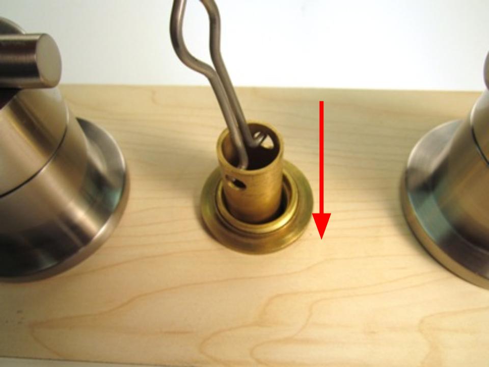 To install the new diverter, slide it into the spout body and push down until it stops.