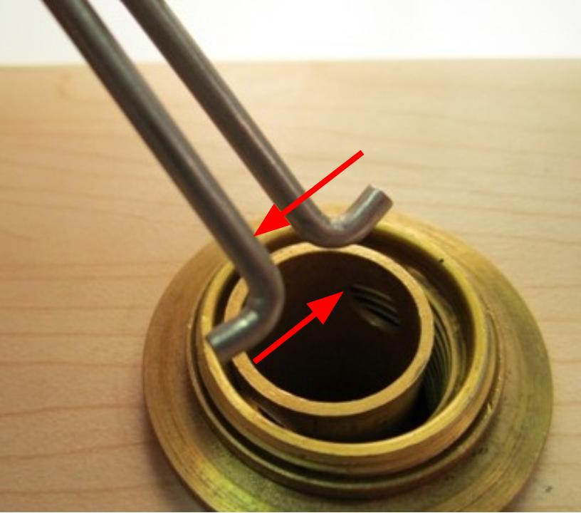 Pinch the diverter tool together and insert the tool into the diverter.