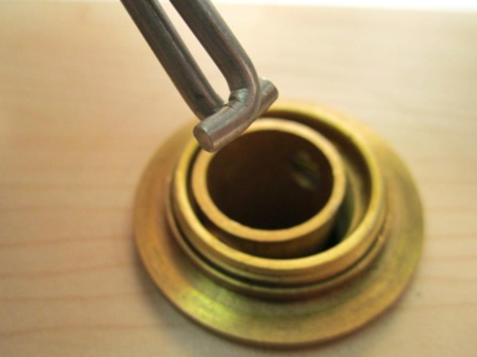 Pinch the diverter tool together and insert the tool into the diverter.