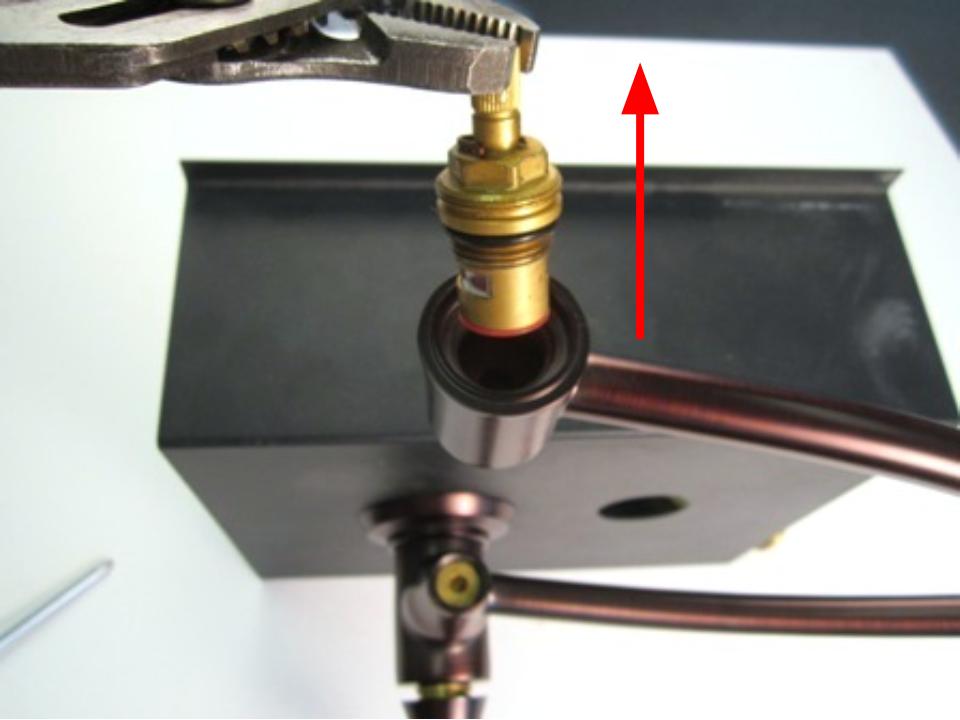 Holding the stem of the cartridge, pull up until the faucet is completely removed from the faucet body.