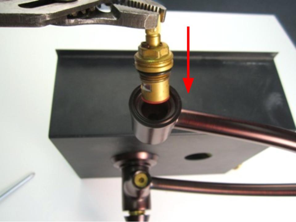 To install the new cartridge, sit the cartridge into the faucet body and turn clockwise to thread it in.