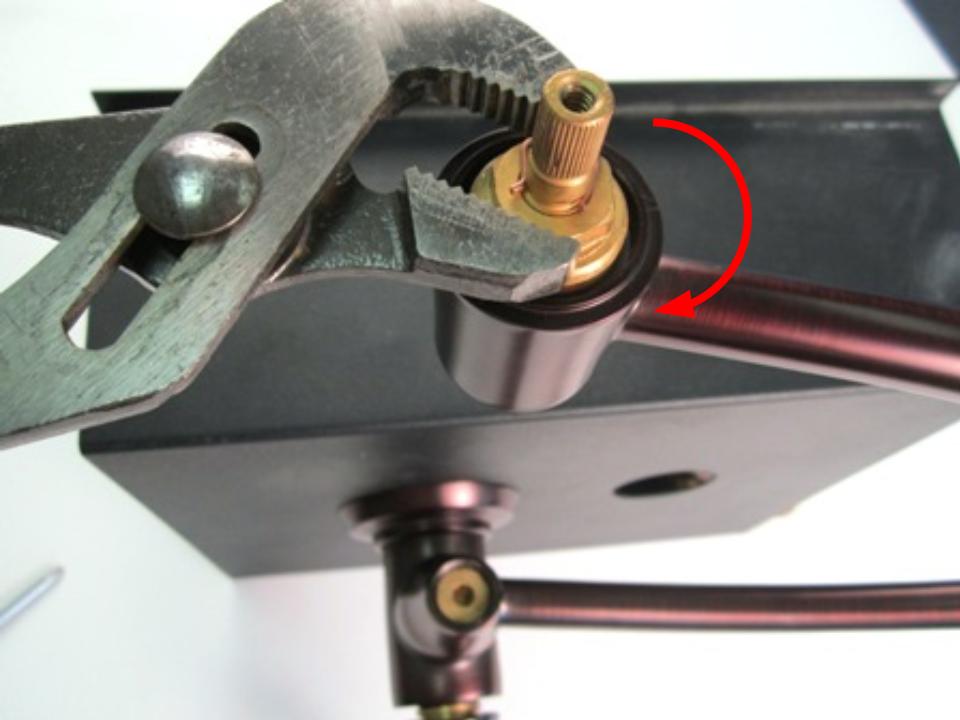 Re-install the cartridge with a pair of adjustable pliers. In order to avoid over tightening the cartridge, hand tighten the locking nut, and then use the adjustable pliers to apply a quarter turn. Approximately 10-14 lbs of torque are required to properly install the locking nut.