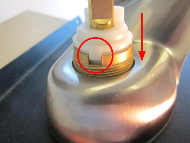  To install the new cartridge, slide the cartridge into the faucet body and rotate the cartridge until the plastic notches line up with the openings in the faucet body.