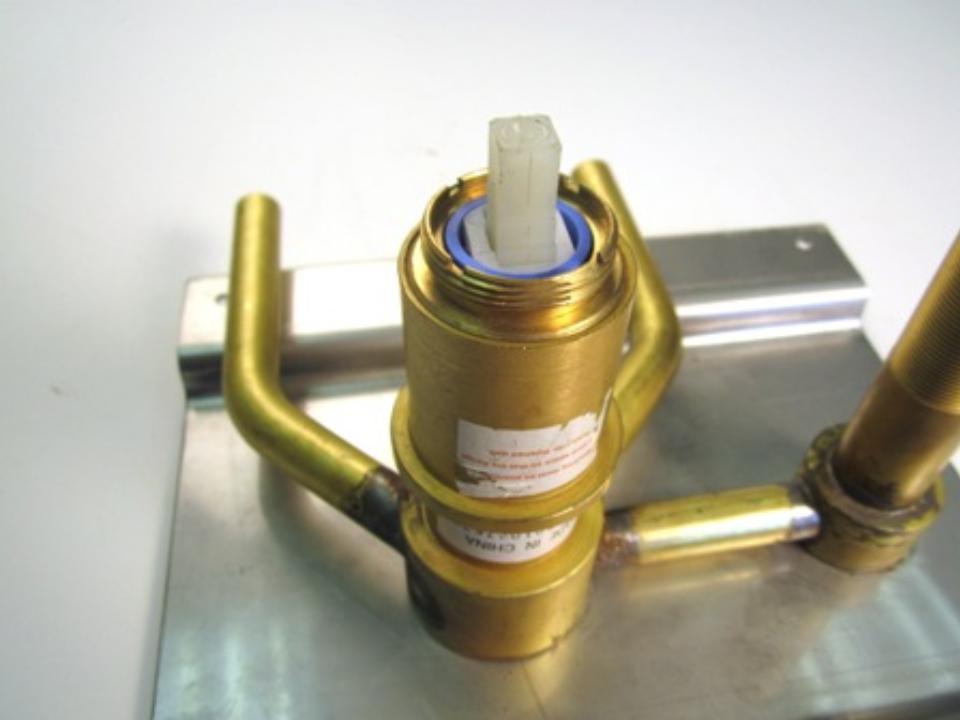 Using a pair of adjustable pliers, remove the locking nut. 
