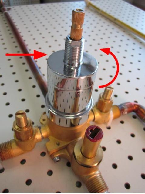 To remove the cartridge, begin by removing the base nut, followed by the sleeve