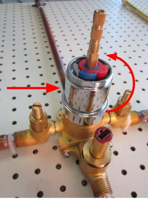 To remove the cartridge, begin by removing the base nut, followed by the sleeve.