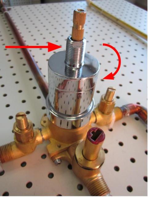 Re-install the base nut and hand tighten.