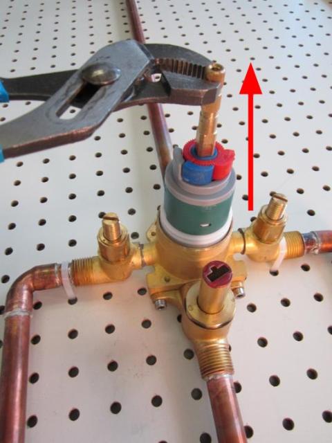 Hold the stem of the cartridge and pull up until the cartridge is completely removed from the faucet body.