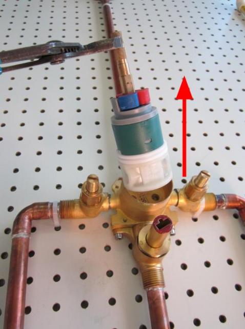 Hold the stem of the cartridge and pull up until the cartridge is completely removed from the faucet body.