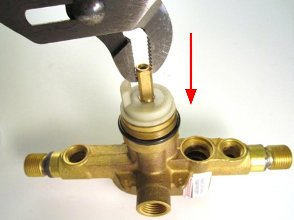 To install the new cartridge, slide the cartridge into the faucet body and rotate the cartridge until the cartridge stopper is in the 9 o’clock position.