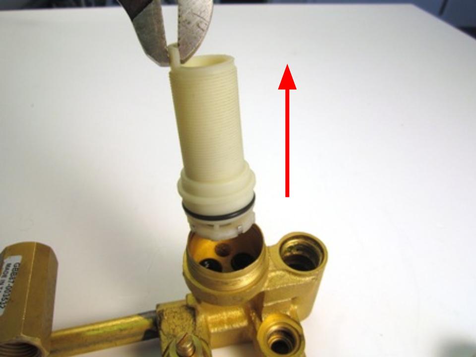  With the trim ring/locking nut removed, pull the threaded shank of the cartridge assembly straight out. Remove the cartridge by holding the stem and pulling straight out.