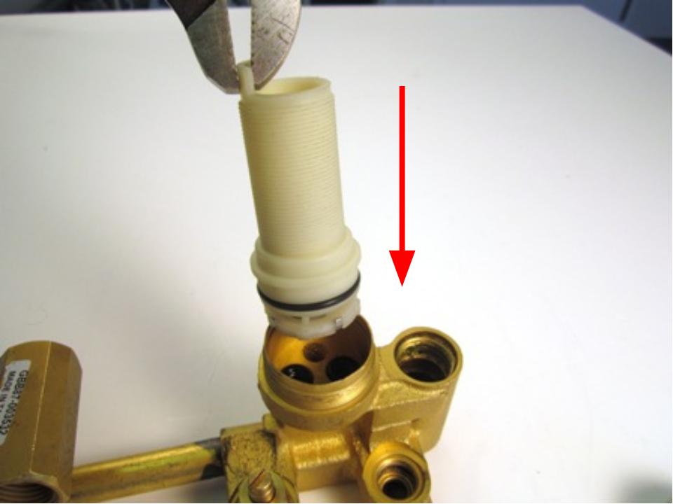 Reinstall the trim cap/locking nut threaded shank with an adjustable wrench twisting clockwise.  This piece requires 10-14 lbs of torque.  Generally that is hand tight, plus a half turn clockwise