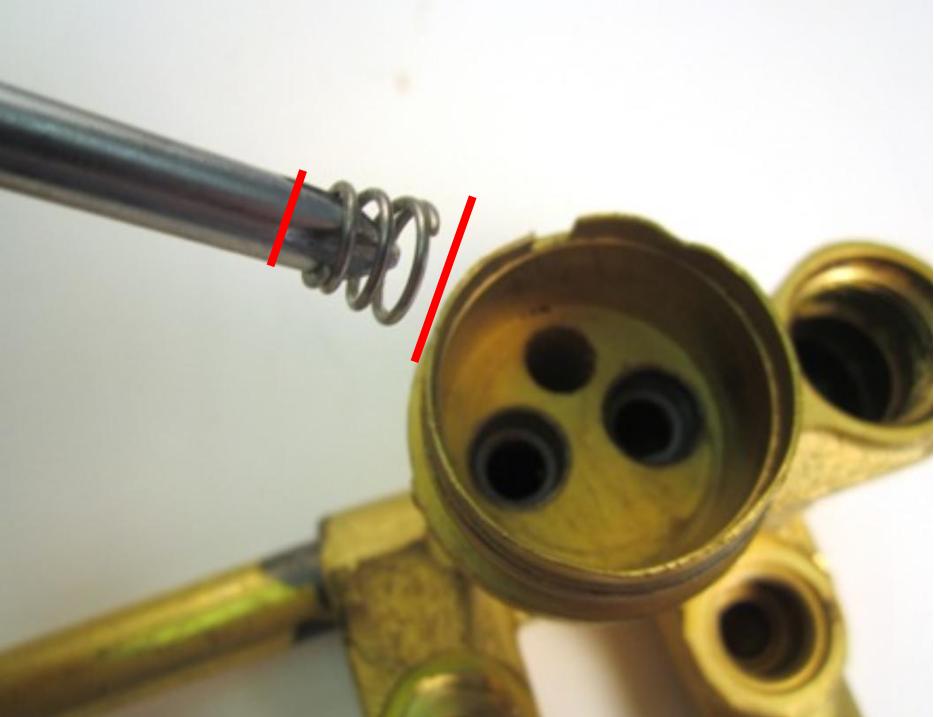  Install the new seats and springs. To do so, insert the spring into the faucet body. The larger end of the spring goes in first.