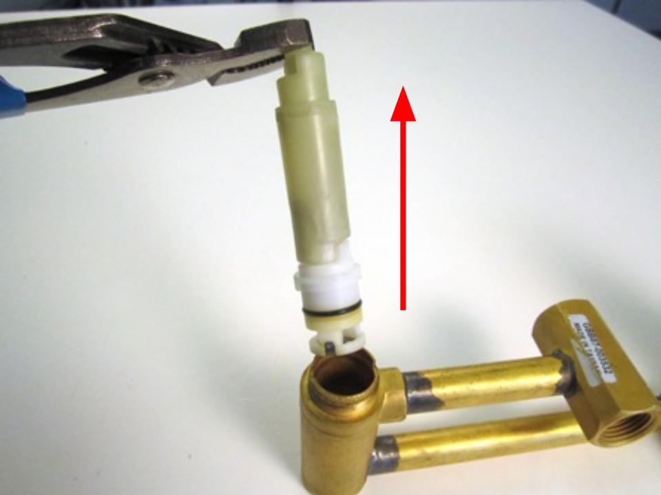 Remove the stem extension by pulling straight out.  The cartridge will likely come off with the extension. 