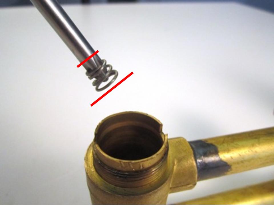 Install the new seats and springs. To do so, insert the spring into the faucet body. The larger end of the spring goes in first.